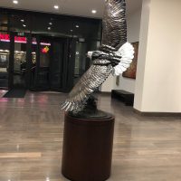 eagle statue in a lobby of an office building